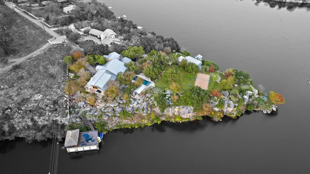 an aerial view of multiple houses with yard