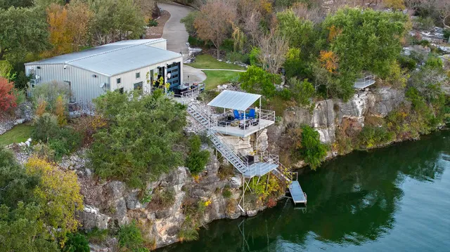 a living room with furniture fireplace and cabinet