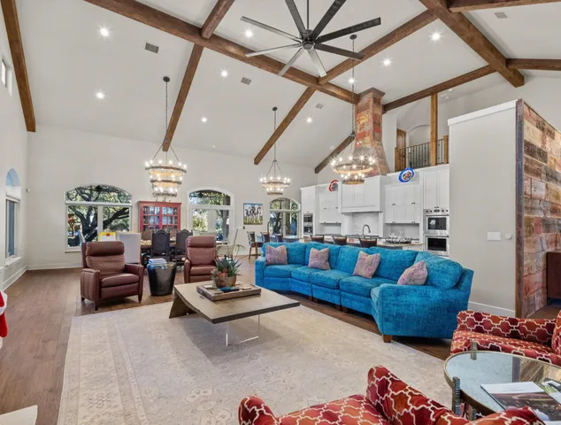 a living room with furniture fireplace and a flat screen tv