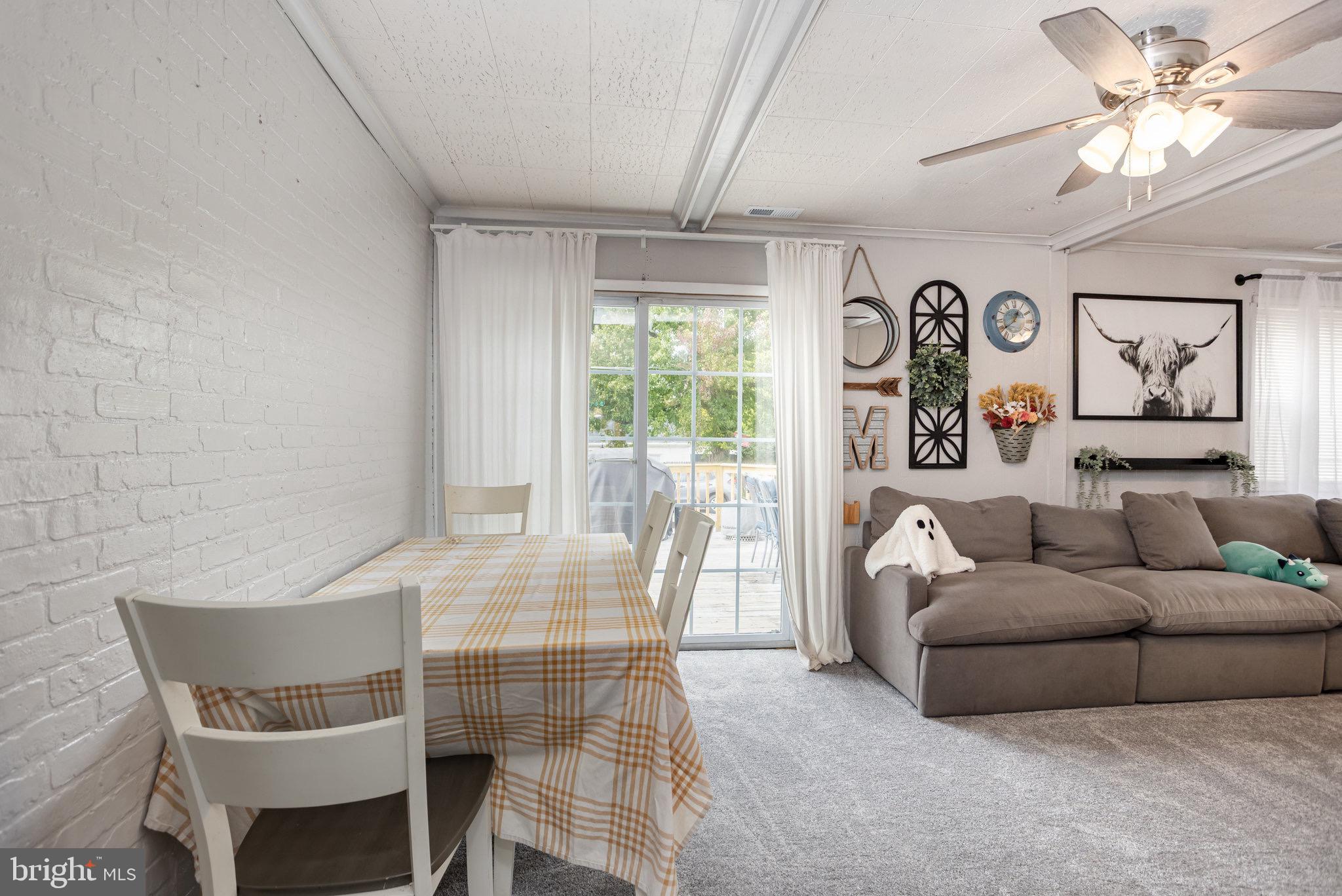 33 Honeycomb Road Middle River, MD 21220 - Photo 12 of 29 a living room with furniture and a large window