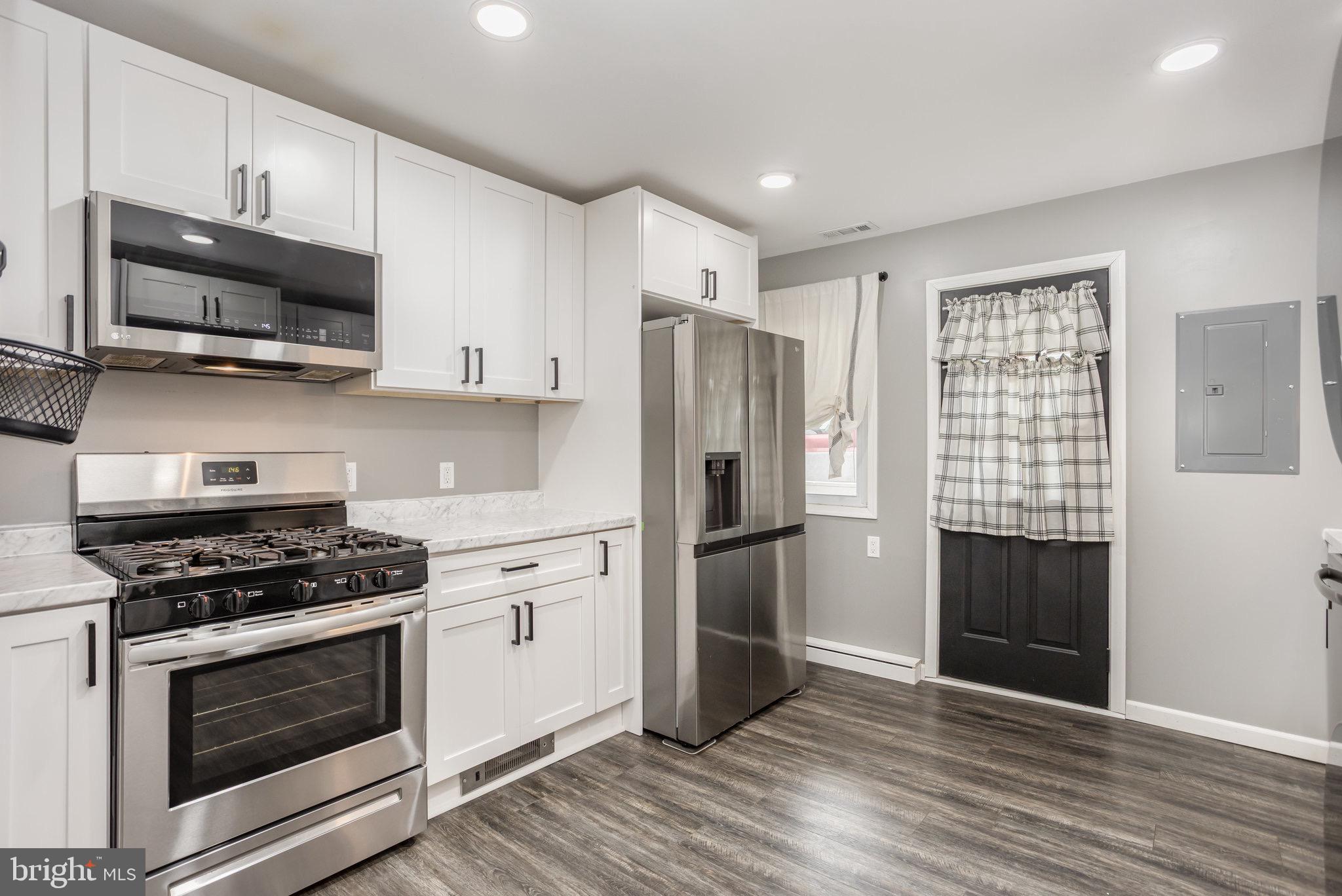 33 Honeycomb Road Middle River, MD 21220 - Photo 16 of 29 a kitchen with stainless steel appliances a refrigerator stove and microwave