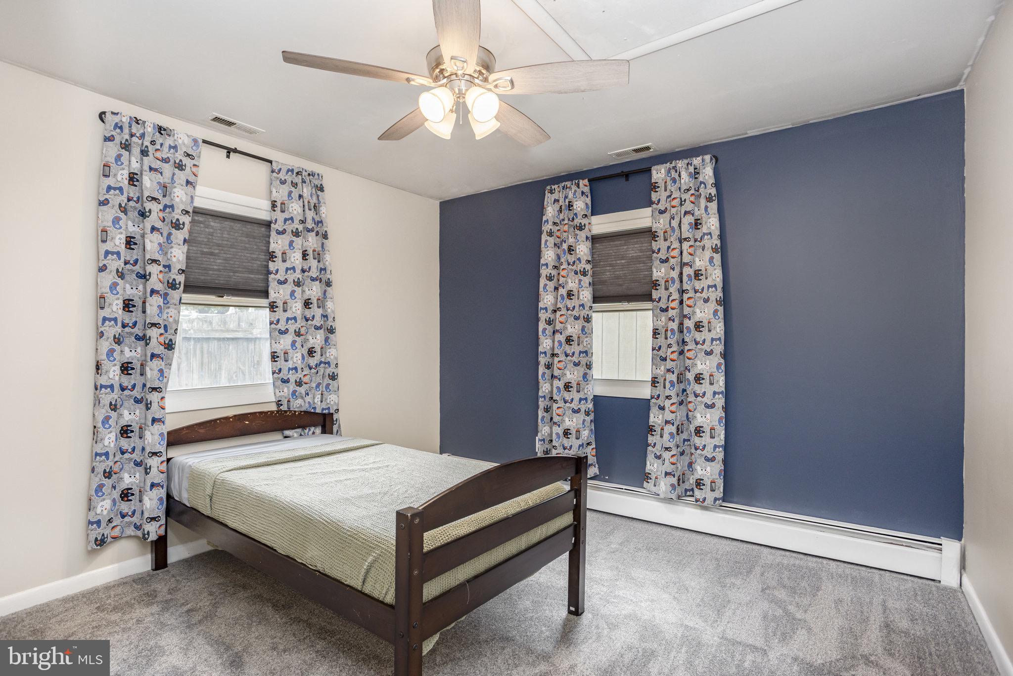 33 Honeycomb Road Middle River, MD 21220 - Photo 21 of 29 a bedroom with a large bed and a chandelier