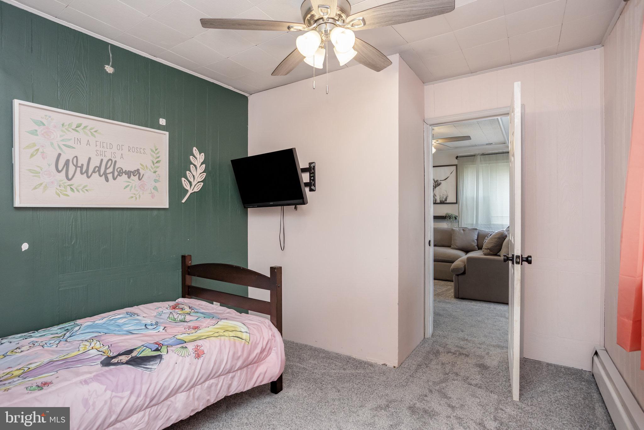 33 Honeycomb Road Middle River, MD 21220 - Photo 24 of 29 a bedroom with a bed and a flat tv screen