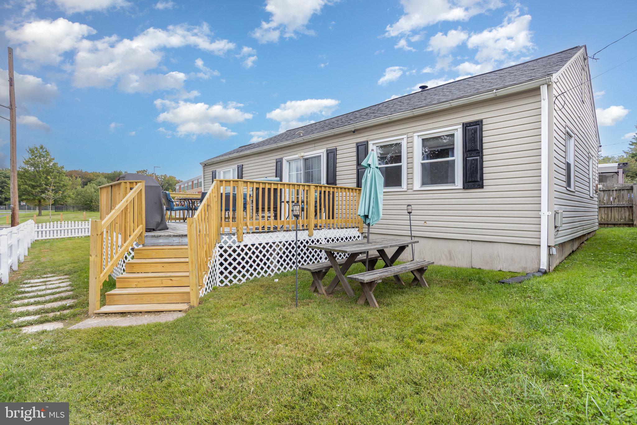 33 Honeycomb Road Middle River, MD 21220 - Photo 27 of 29 a view of a house with backyard and wooden fence