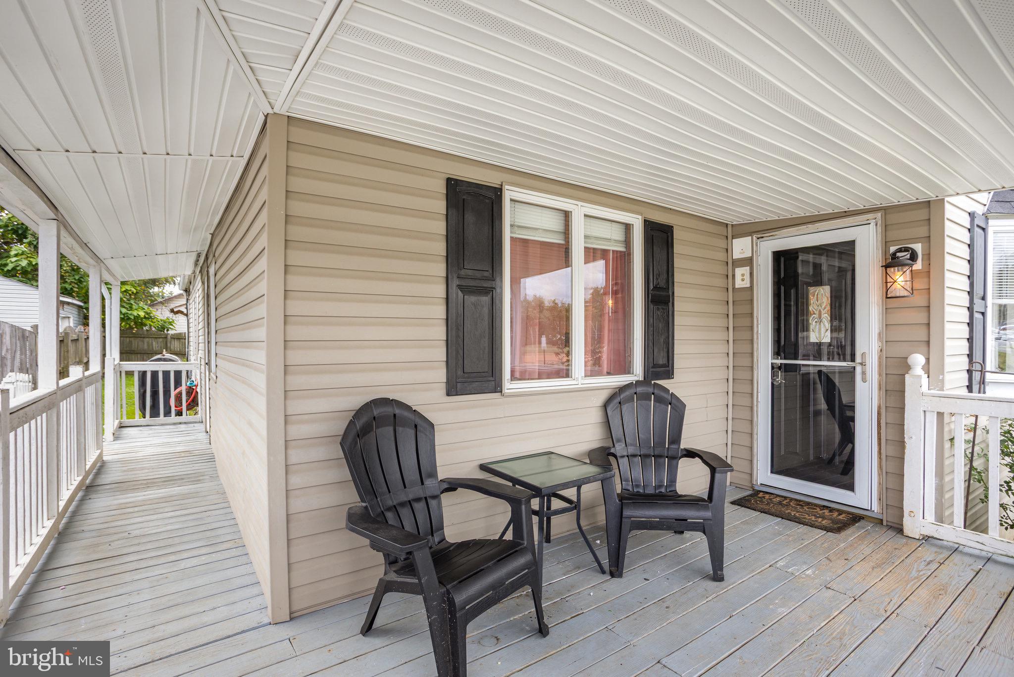 33 Honeycomb Road Middle River, MD 21220 - Photo 5 of 29 a view of a two chairs and table in a patio