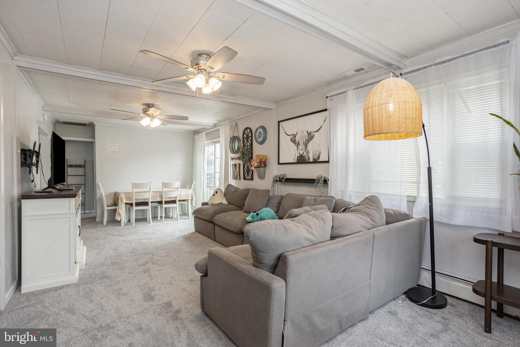 33 Honeycomb Road Middle River, MD 21220 - Photo 8 of 29 a living room with furniture and a chandelier