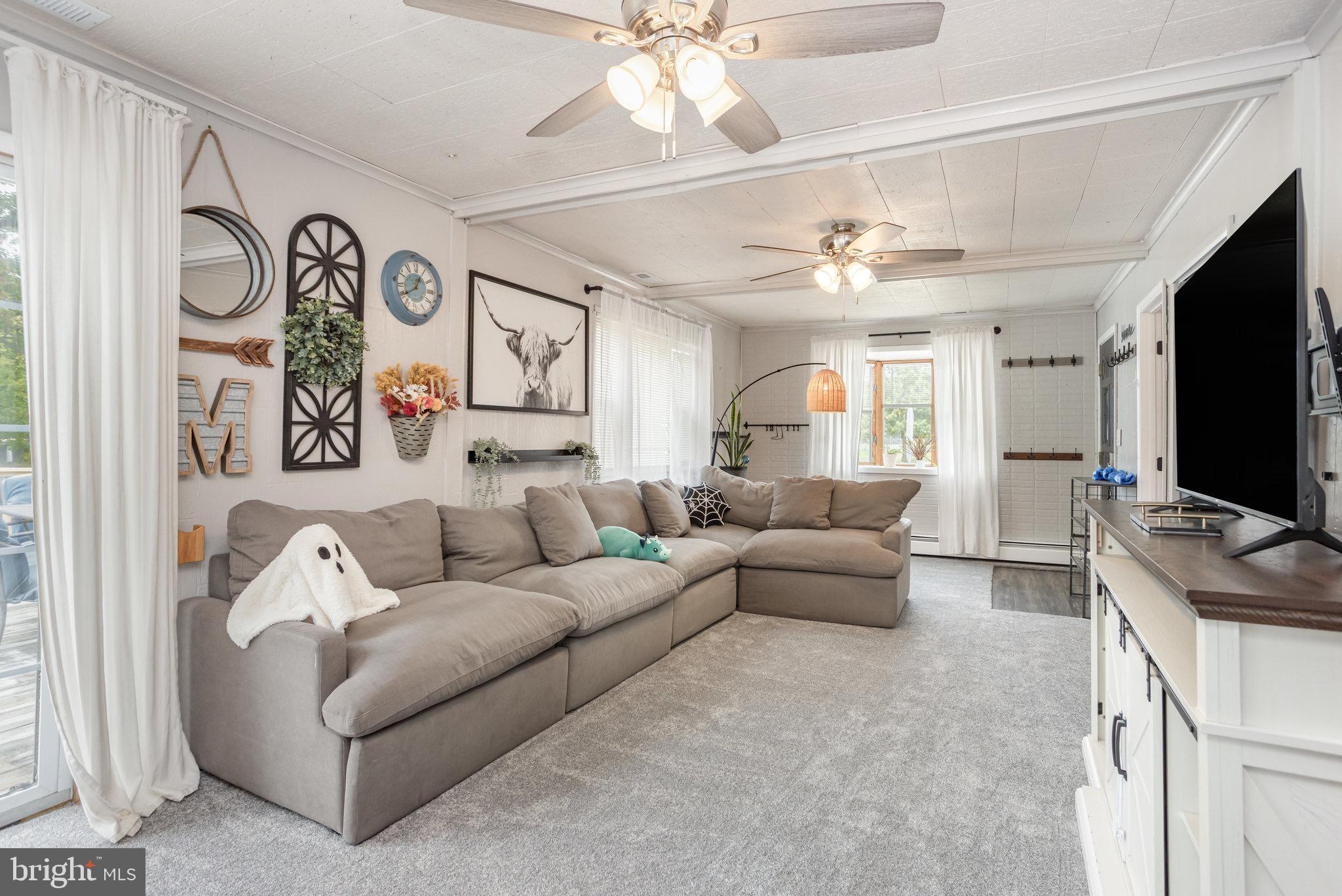 33 Honeycomb Road Middle River, MD 21220 - Photo 10 of 29 a living room with furniture and a flat screen tv