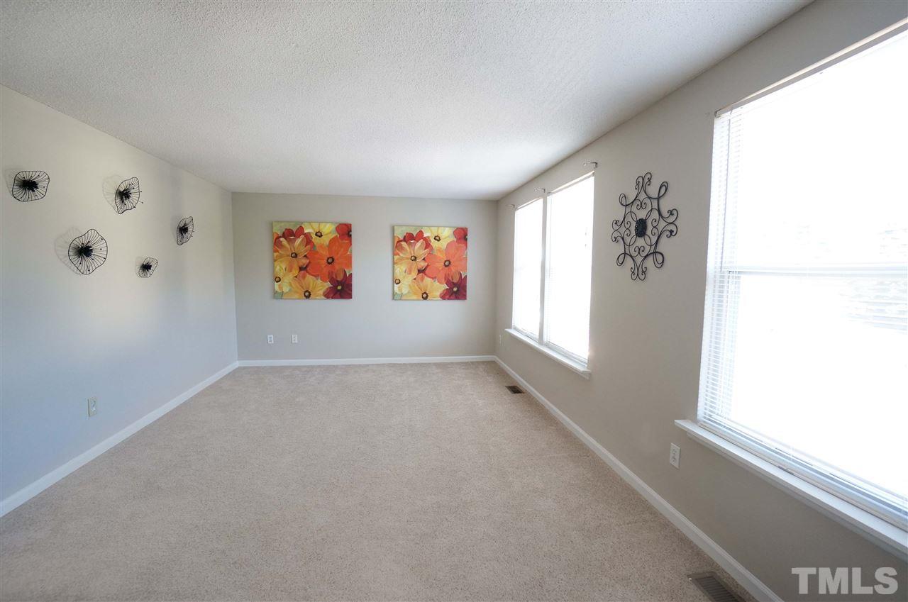 1137 Villa Green Court Raleigh, NC 27612 - Photo 12 of 14 Bright & spacious bedroom offers space & versatility for your growing needs.