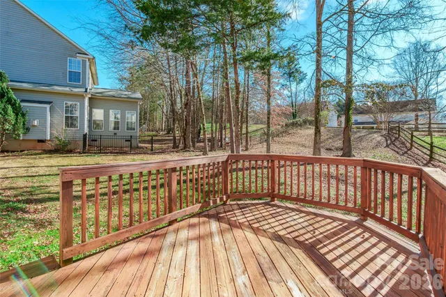 a view of a wooden deck with a yard