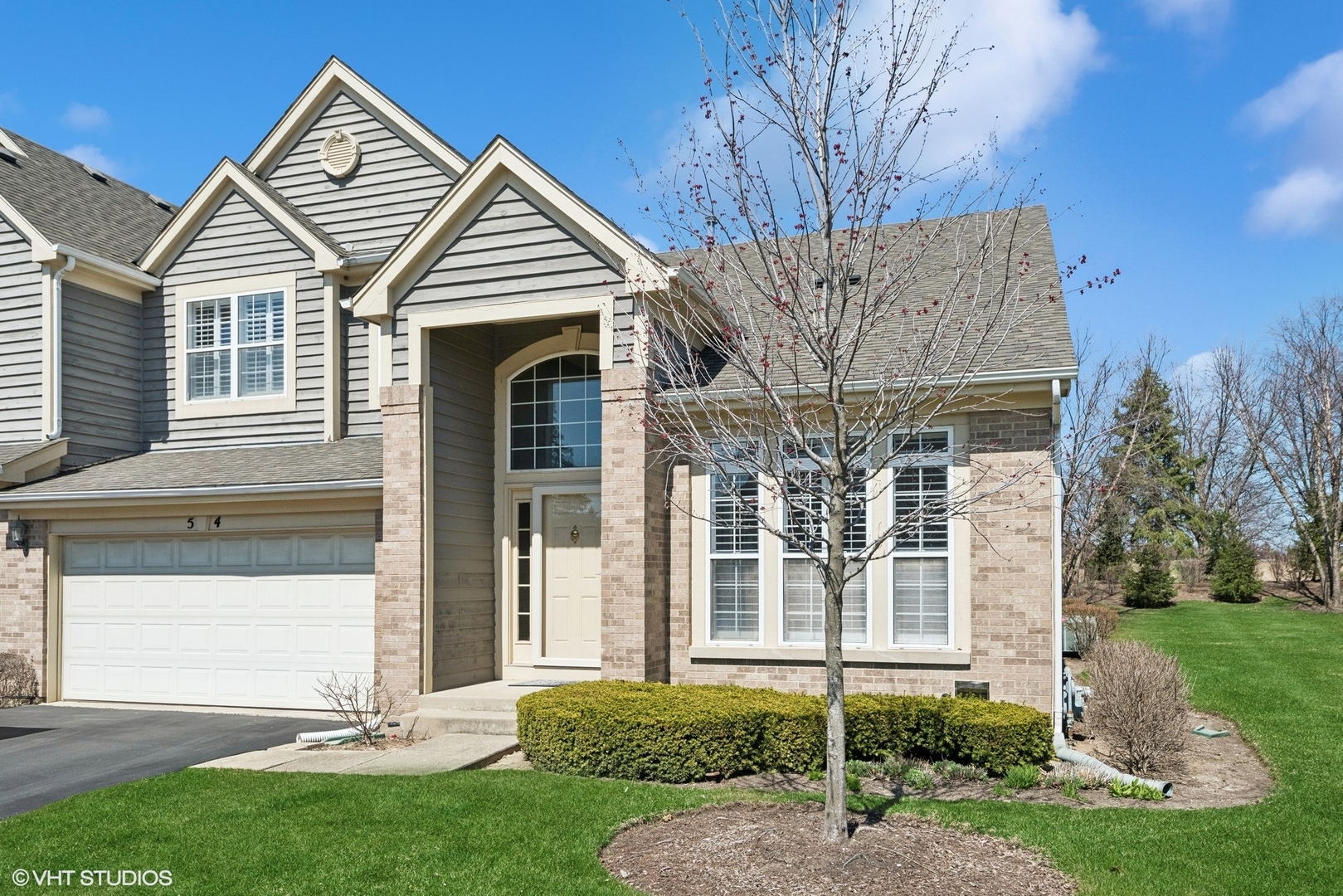 front view of a house with a yard
