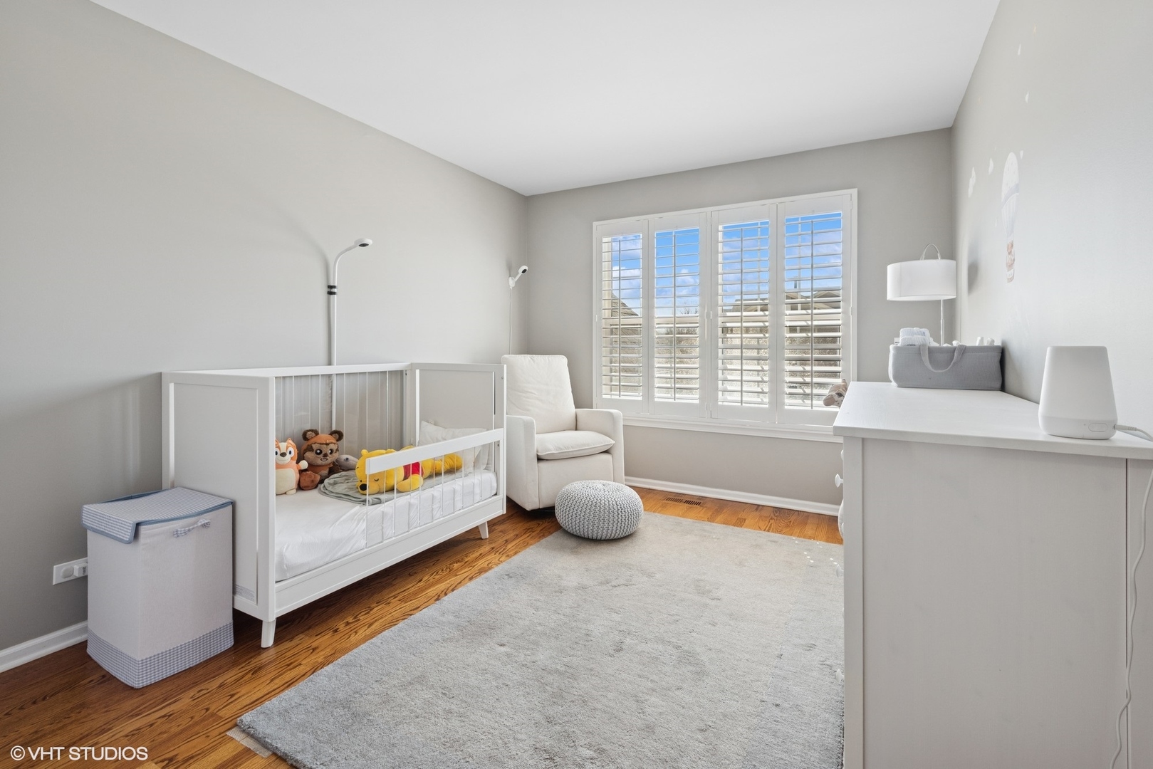 54 Andover Circle Northbrook, IL 60062 - Photo 16 of 26 a very nice looking room with a white bed and a couch