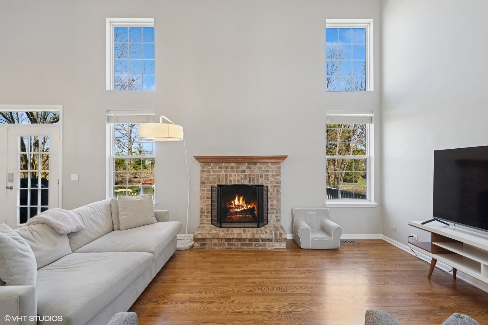 54 Andover Circle Northbrook, IL 60062 - Photo 3 of 26 a living room with furniture flat screen tv and a fireplace