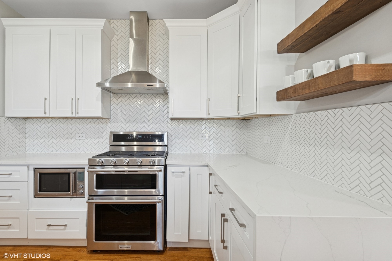 54 Andover Circle Northbrook, IL 60062 - Photo 10 of 26 a kitchen with stainless steel appliances a stove a white cabinet and a granite counter tops