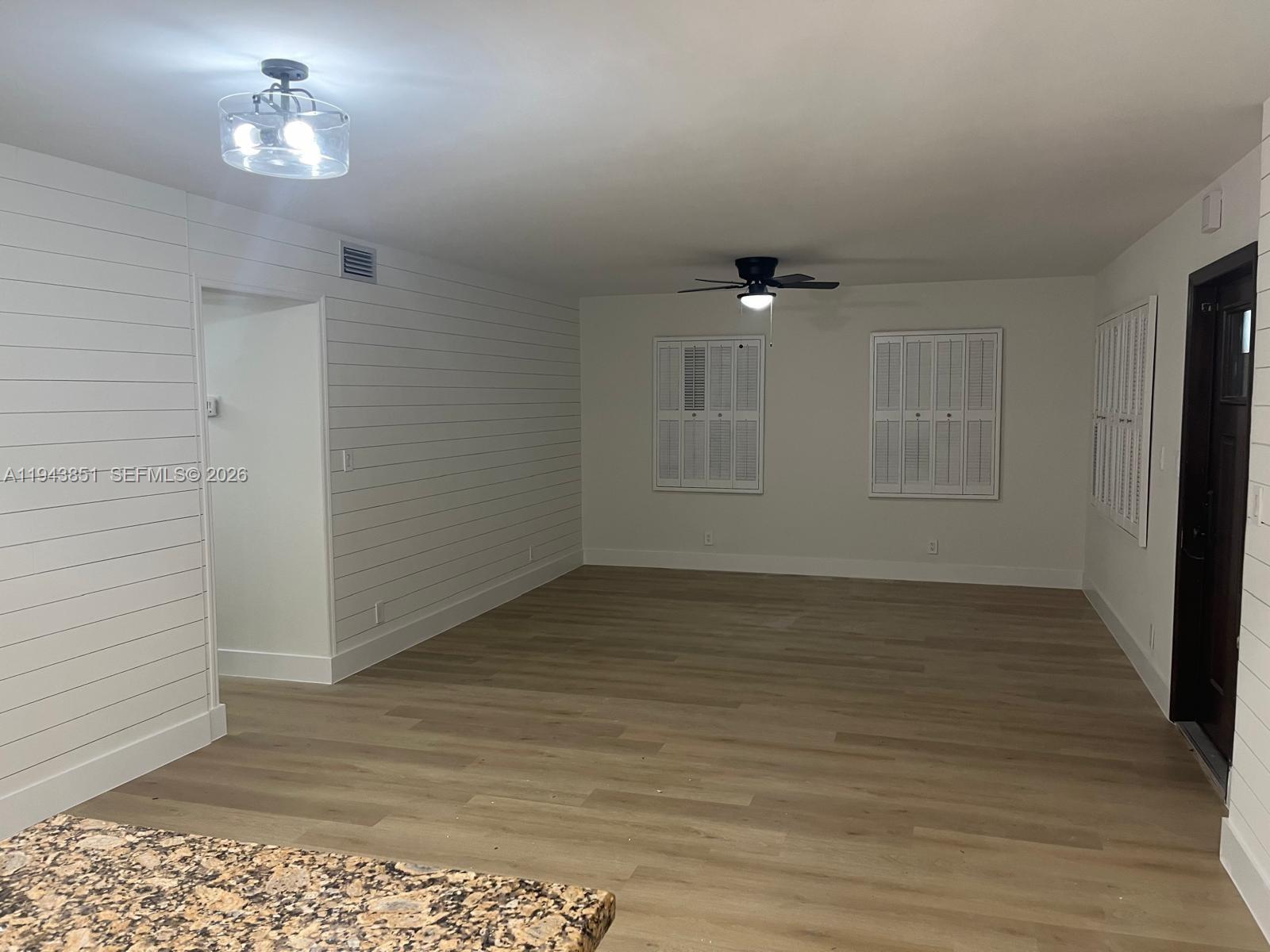 6330 Southwest 34th Street Miami, FL 33155 - Photo 6 of 22 wooden floor in an empty room with a window