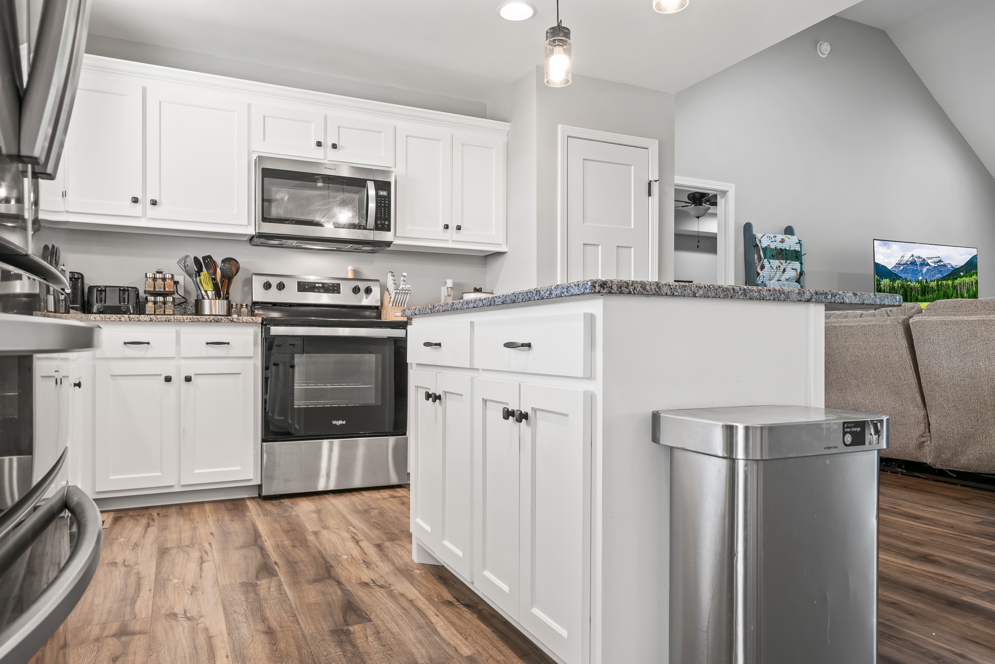 8606 Fredonia Road Manchester, TN 37355 - Photo 16 of 29 a kitchen with white cabinets and stainless steel appliances
