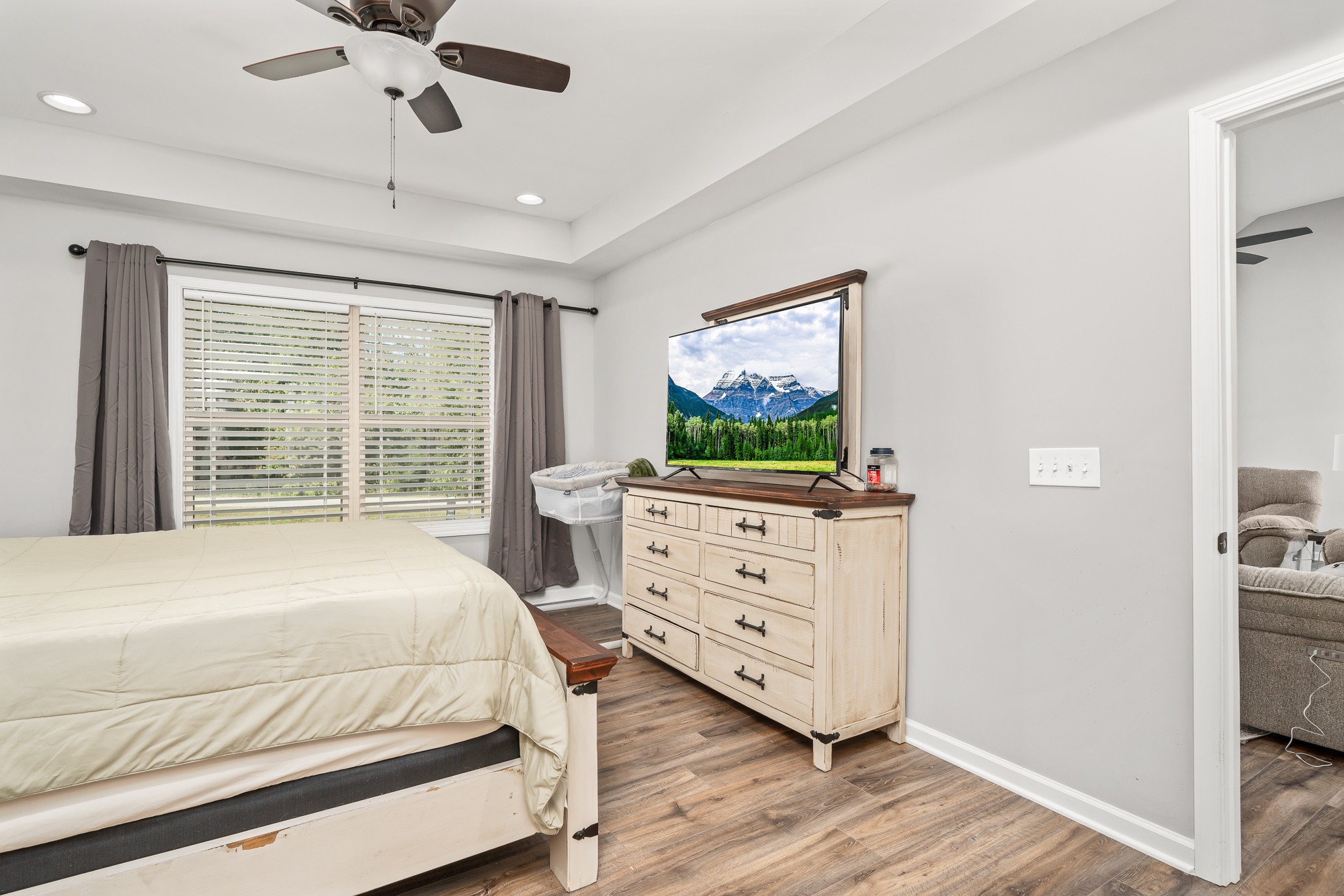 8606 Fredonia Road Manchester, TN 37355 - Photo 18 of 29 a bedroom with a bed and a flat screen tv