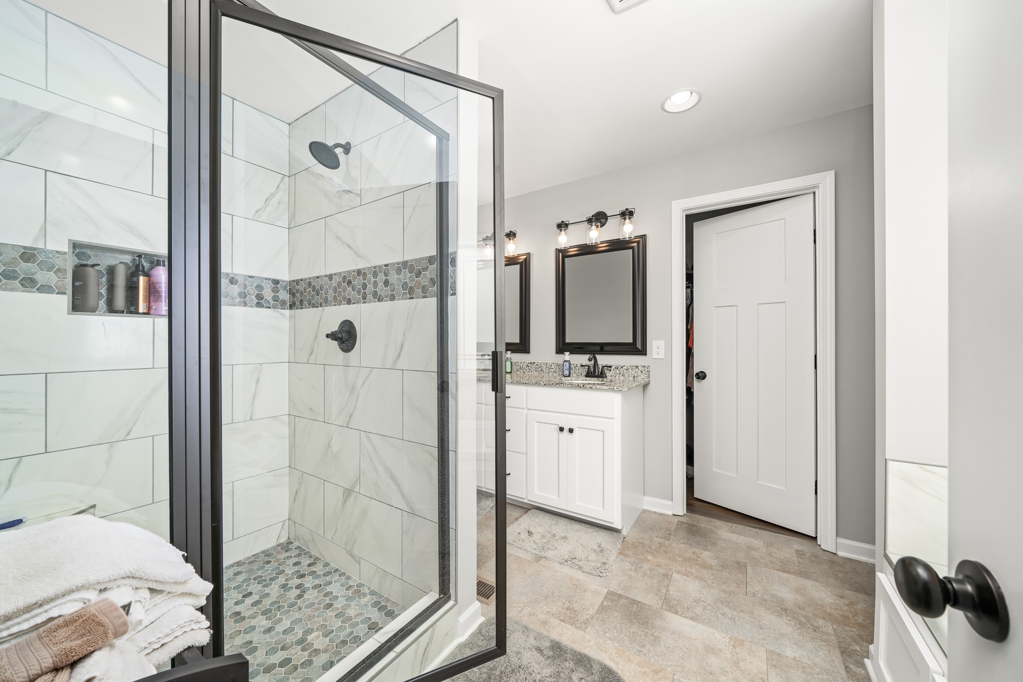 8606 Fredonia Road Manchester, TN 37355 - Photo 19 of 29 a bathroom with a shower a sink and a mirror