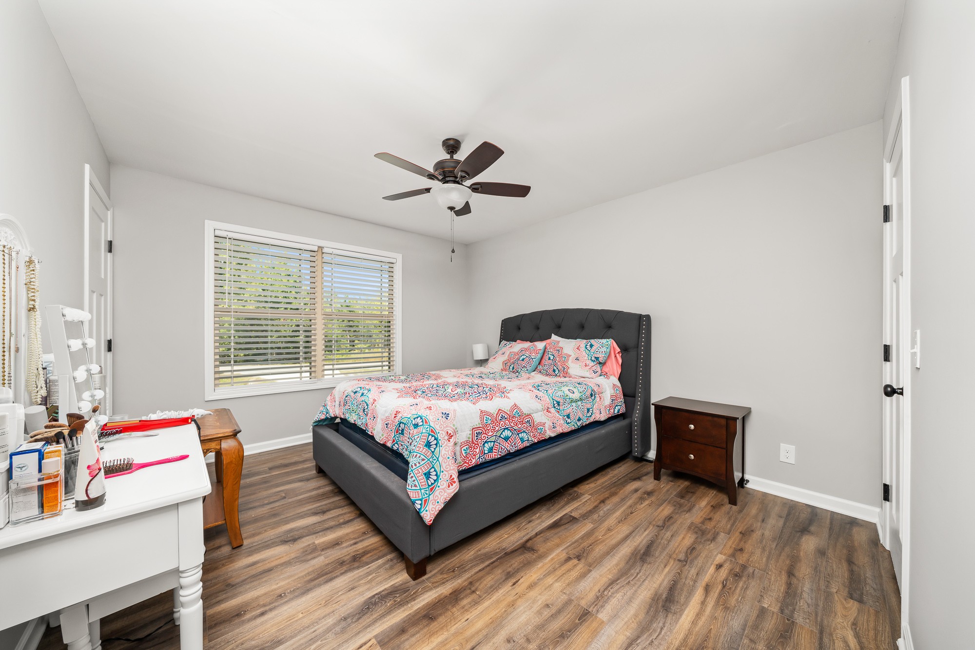 8606 Fredonia Road Manchester, TN 37355 - Photo 23 of 29 a bedroom with a bed and a chandelier