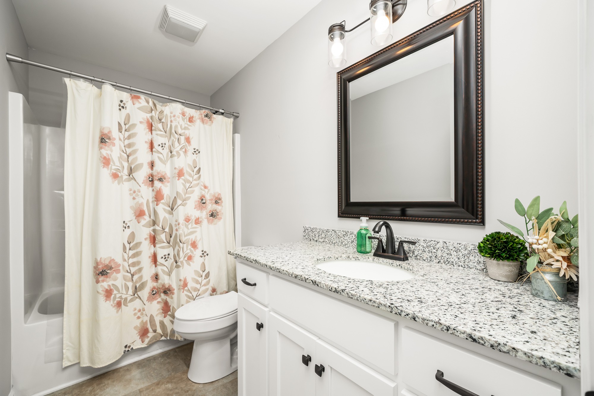 8606 Fredonia Road Manchester, TN 37355 - Photo 24 of 29 a bathroom with a granite countertop sink toilet and mirror