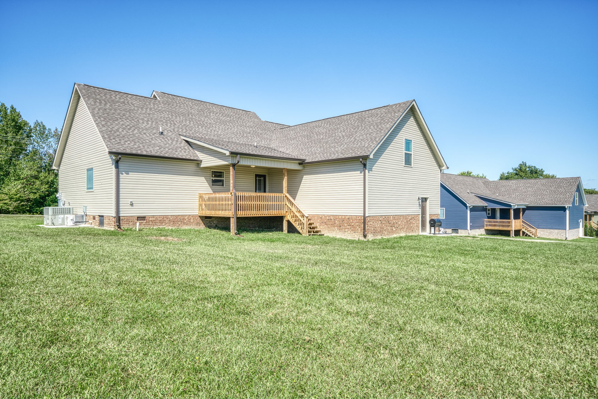 8606 Fredonia Road Manchester, TN 37355 - Photo 6 of 29 a view of a house with a big yard and large trees
