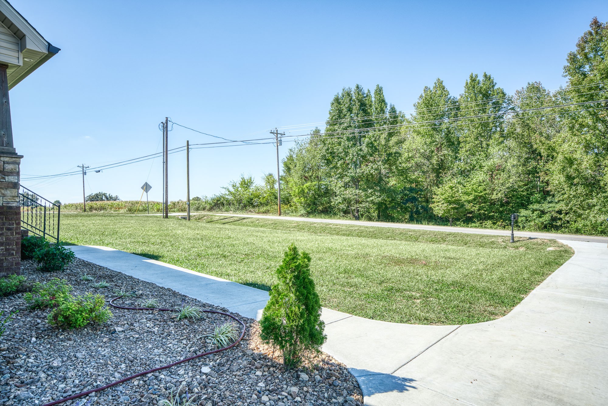 8606 Fredonia Road Manchester, TN 37355 - Photo 8 of 29 a view of a garden with a bench in the background