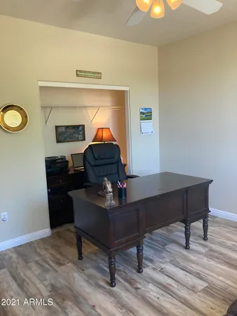 a workspace with furniture and wooden floor