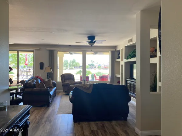 a living room with furniture and a large window