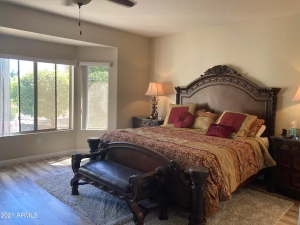 a bedroom with furniture and a window