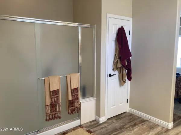 a bedroom with a bed and flat screen tv