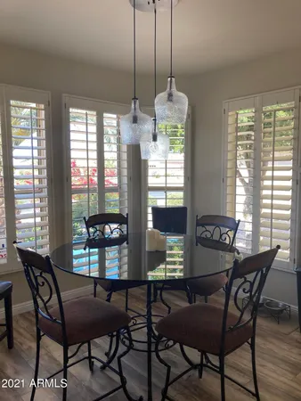 a view of a dining room with furniture window and outside view
