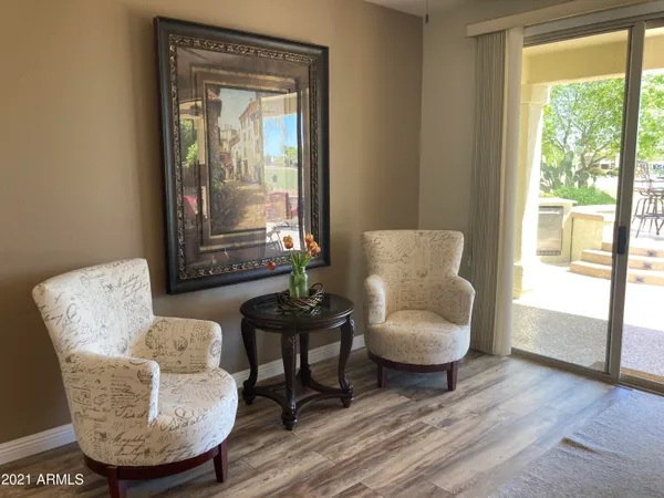a living room with furniture and a large window