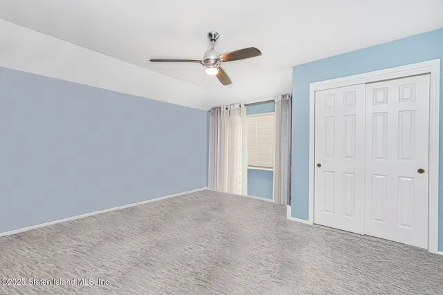 a white stove top oven sitting inside of a kitchen