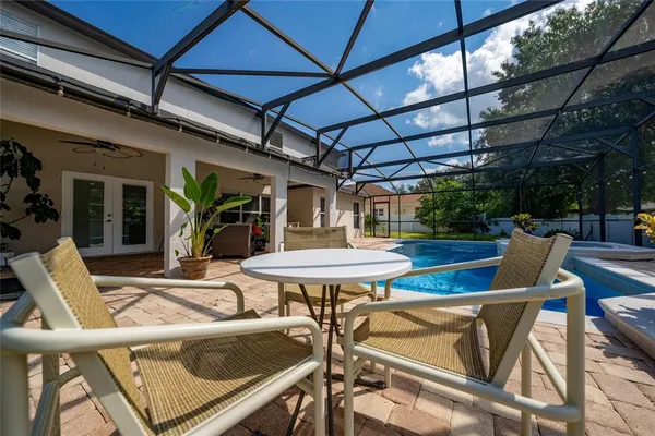 an aerial view of a house with a swimming pool