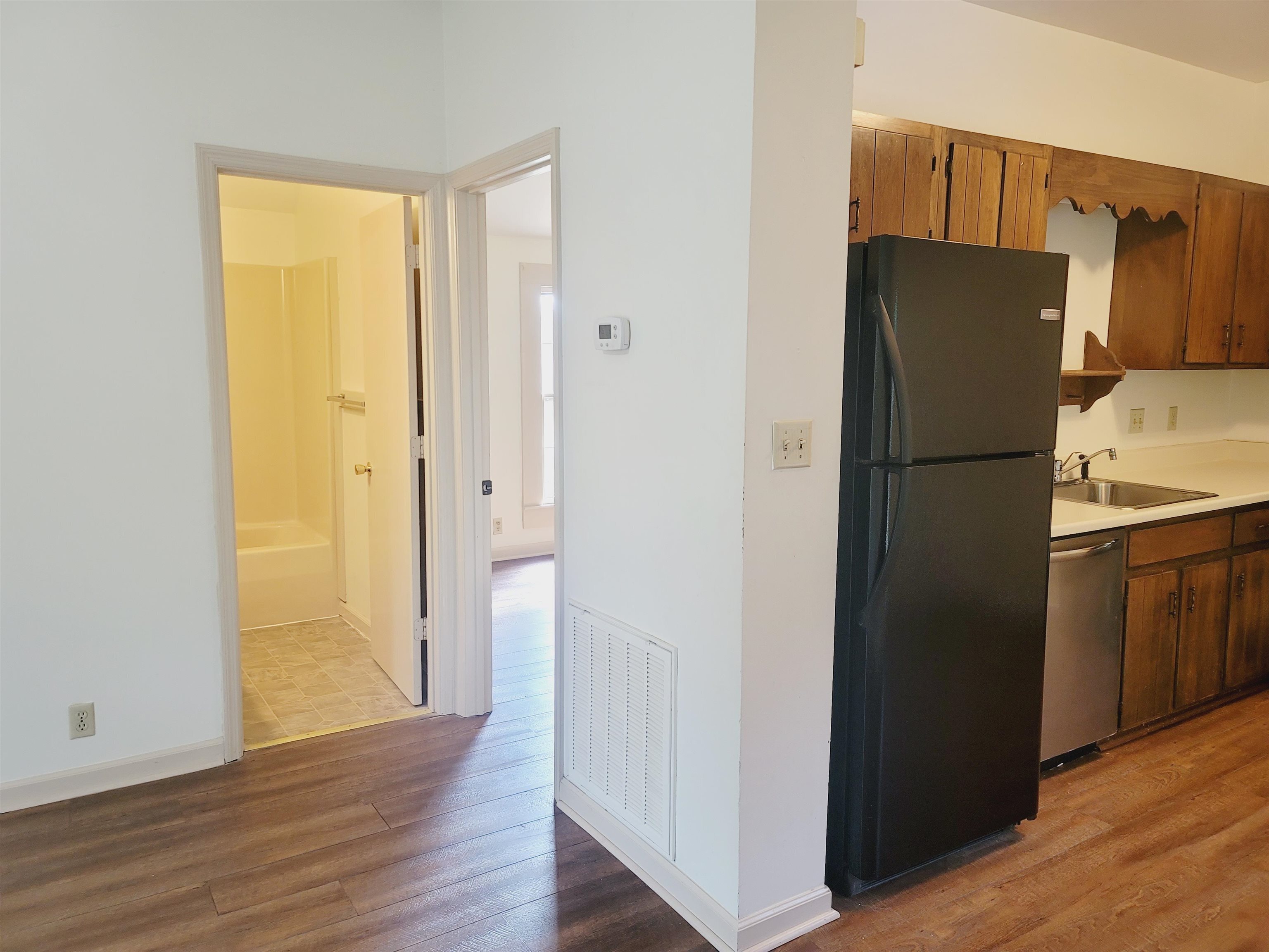 302 Jefferson Street, Unit 2 Springfield, GA 31329 - Photo 11 of 23 a white refrigerator freezer sitting in a kitchen