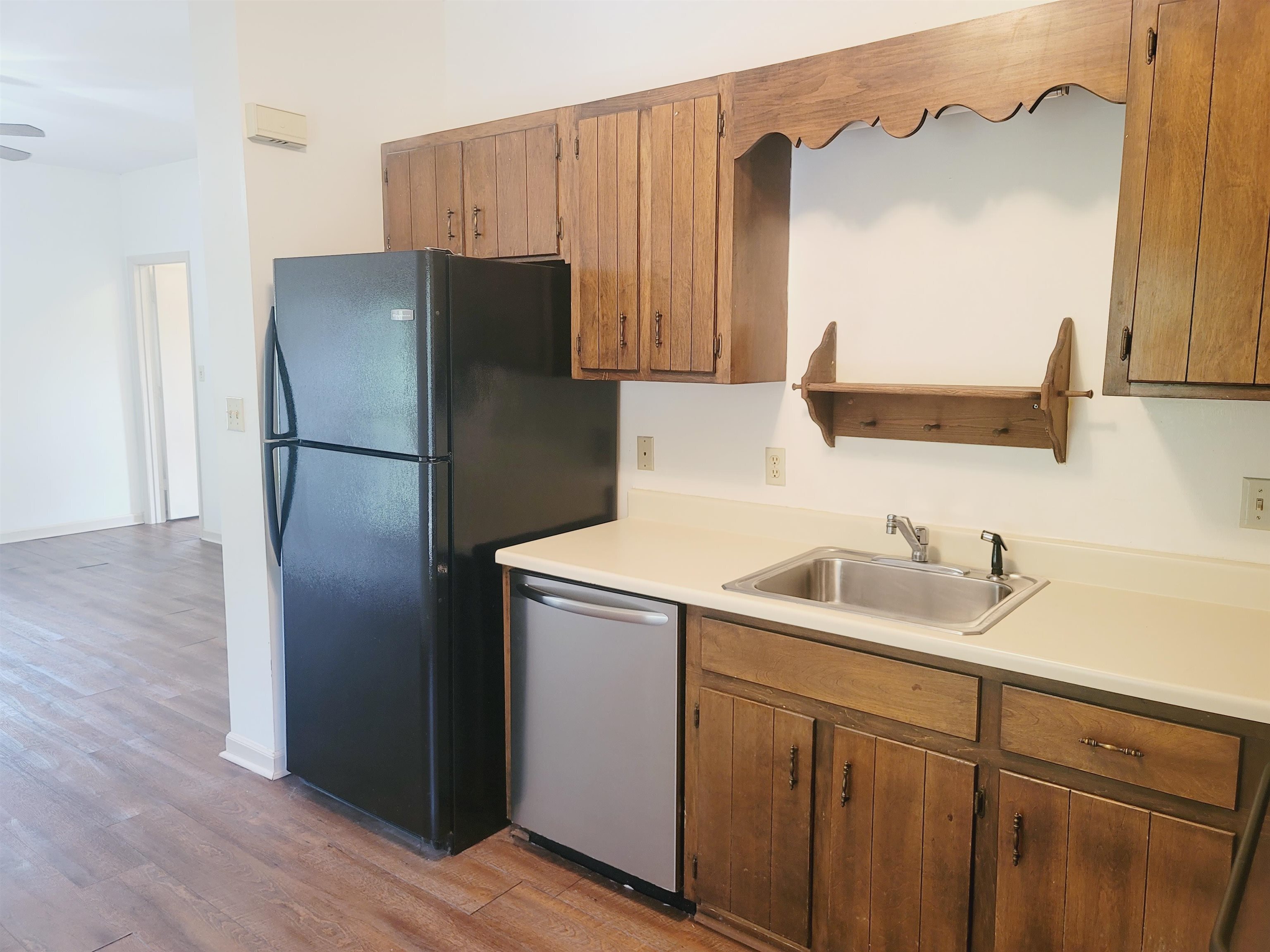 302 Jefferson Street, Unit 2 Springfield, GA 31329 - Photo 12 of 23 a kitchen with a refrigerator sink and cabinets