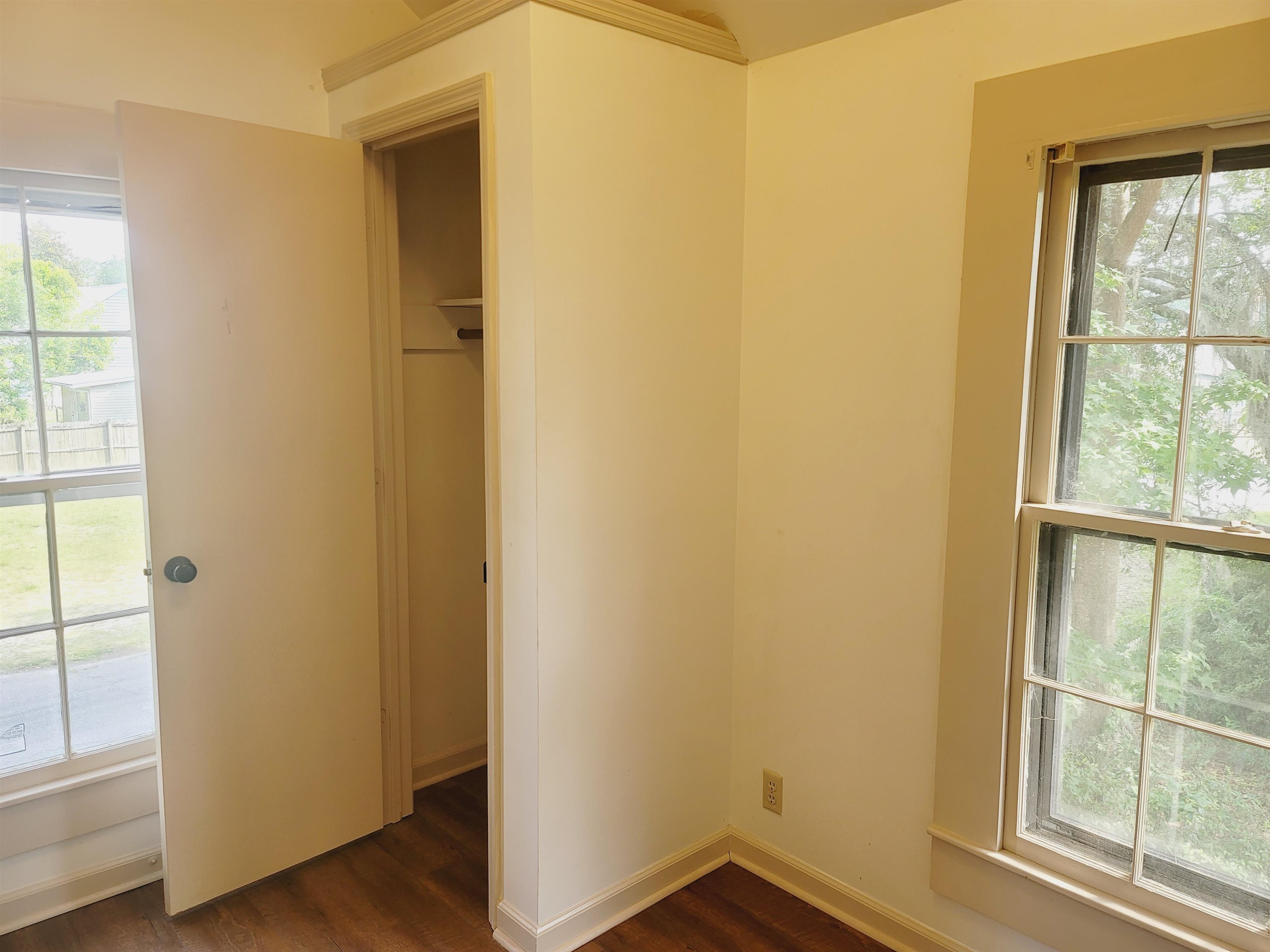 302 Jefferson Street, Unit 2 Springfield, GA 31329 - Photo 21 of 23 an empty room with wooden floor and windows