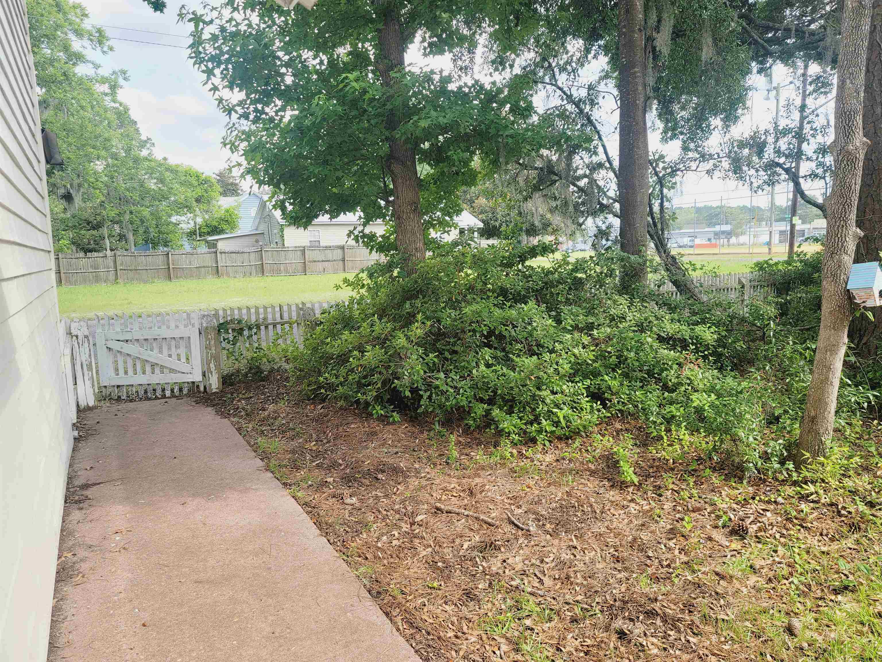 302 Jefferson Street, Unit 2 Springfield, GA 31329 - Photo 3 of 23 a view of a park with large trees