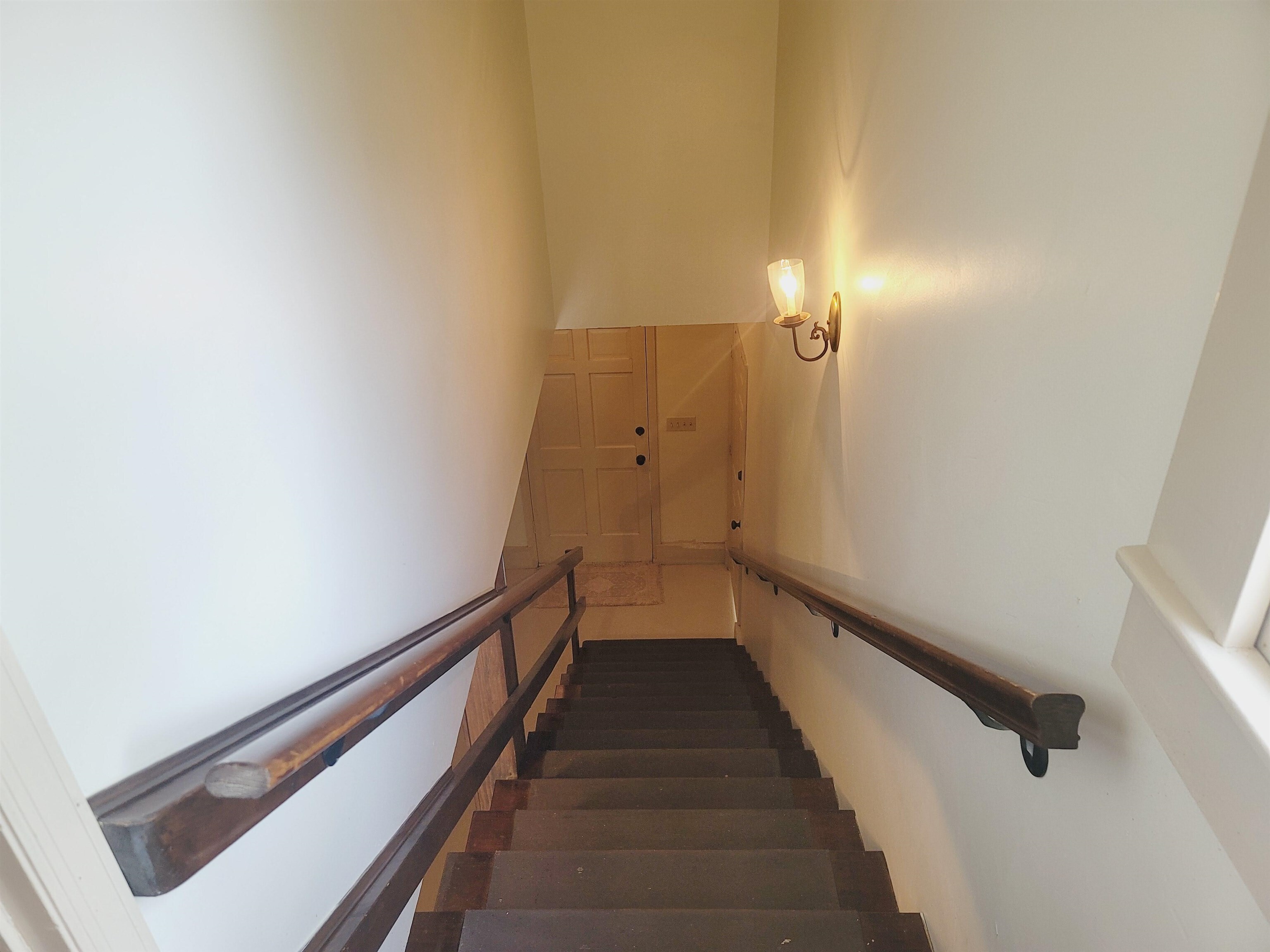 302 Jefferson Street, Unit 2 Springfield, GA 31329 - Photo 8 of 23 a view of a hallway with wooden floor and staircase