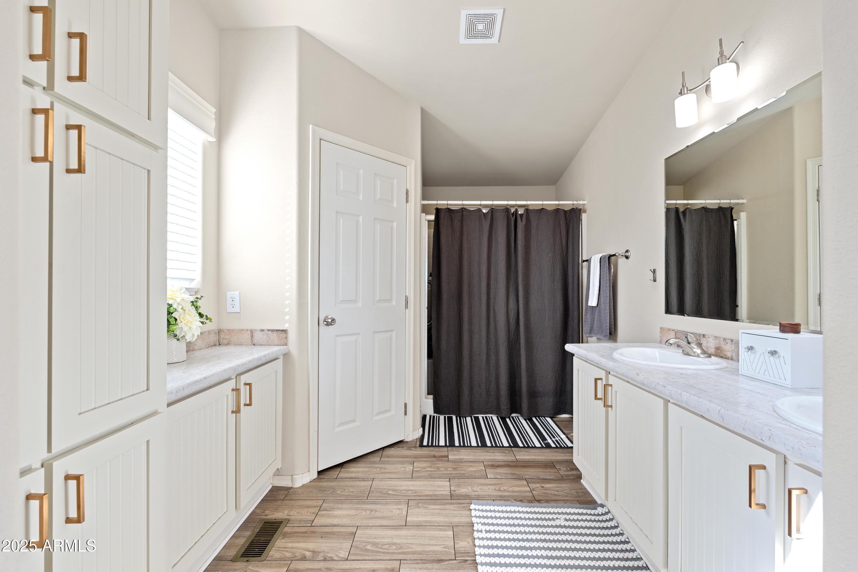 1033 Wheeler Road Camp Verde, AZ 86322 - Photo 19 of 51 a bathroom with a sink a mirror and a shower