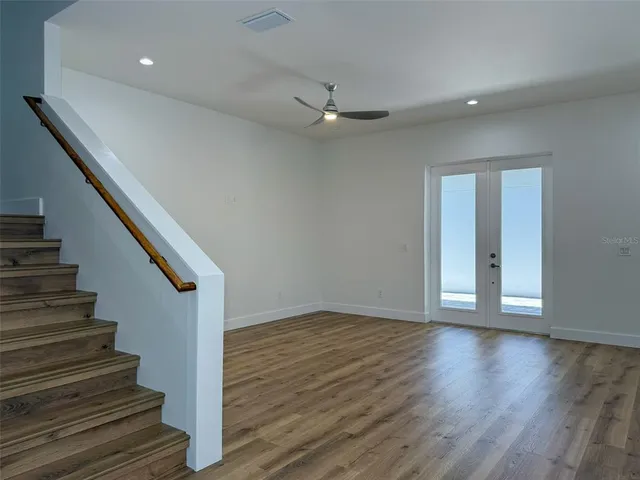 a kitchen with kitchen island granite countertop a sink a counter space appliances and cabinets
