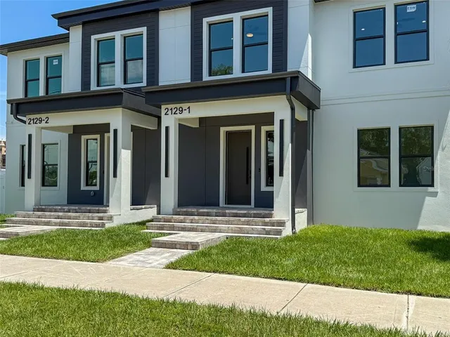 a view of a house with small garden