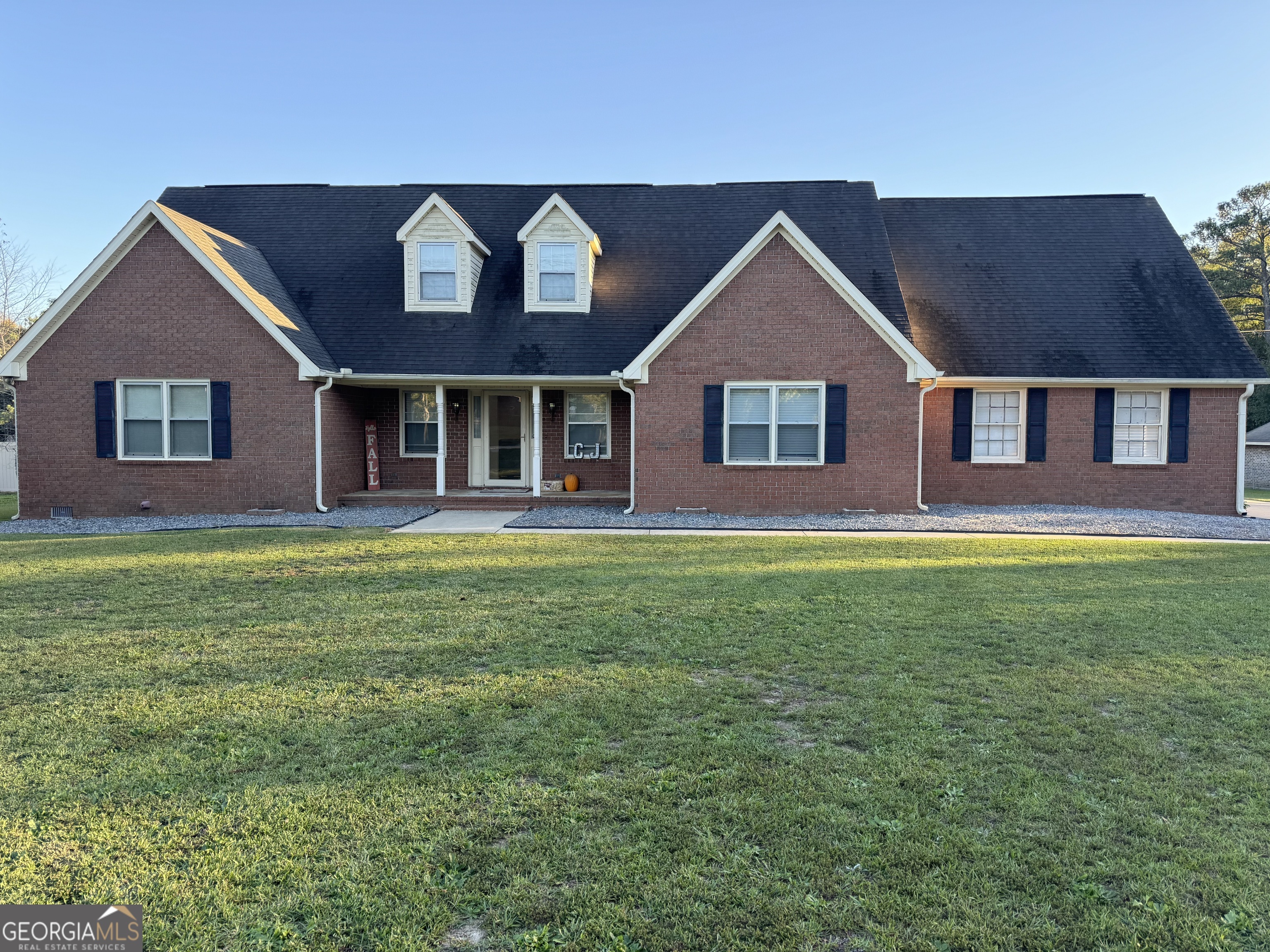 4470 Jones Road Macon, GA 31216 - Photo 1 of 1 a front view of a house with a yard and garage