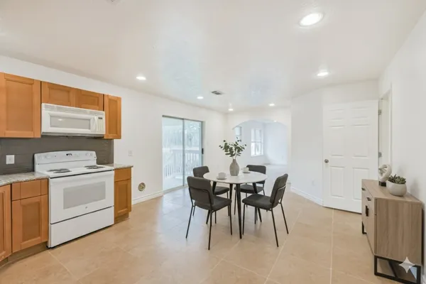 a view of kitchen with cabinets and wooden floor
