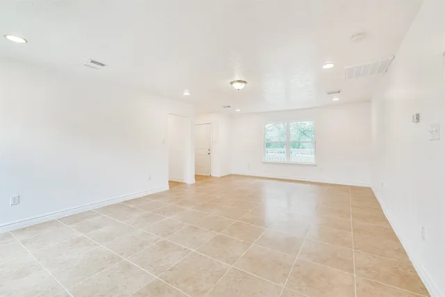 an empty room with a empty space and window