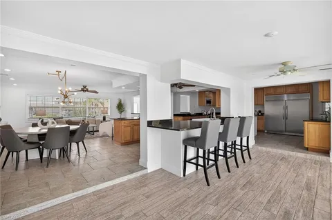 a dining room table chair and a chandelier