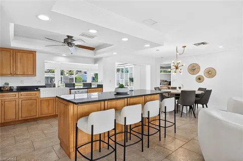a view of a swimming pool with a table and chairs