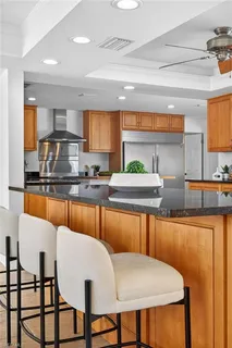 a large kitchen with a table and chairs