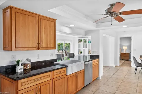 a kitchen with cabinets a sink appliances and a counter top space