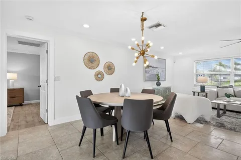 a kitchen with stainless steel appliances granite countertop a sink a stove and cabinets