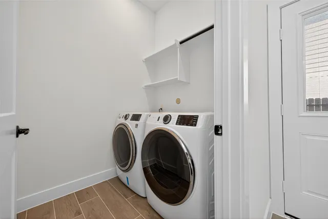 a utility room with dryer and washer